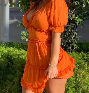 Orange ruffle mini dress